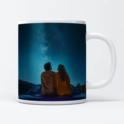 Couple Sitting on Car Under Starry Sky