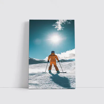 Skier In Orange Suit Sunny Snow Mountain
