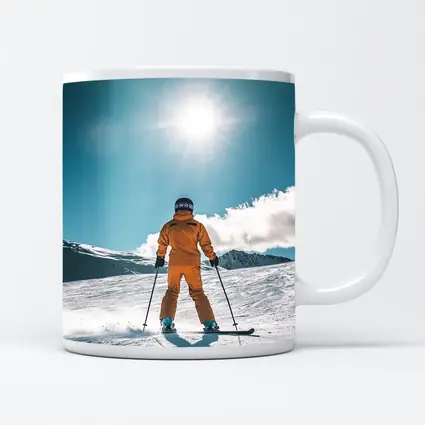 Skier In Orange Suit Sunny Snow Mountain