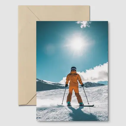 Skier In Orange Suit Sunny Snow Mountain
