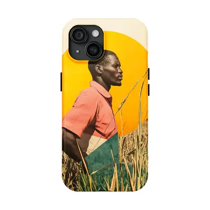 Young Man Standing in Golden Wheat Field