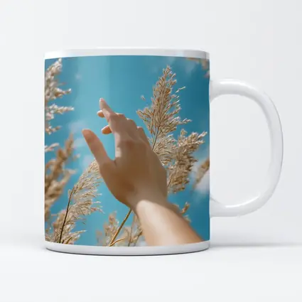 Hand Reaching Through Golden Wheat Blue Sky