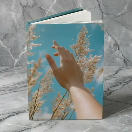 Hand Reaching Through Golden Wheat Blue Sky