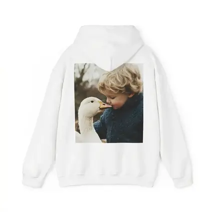 Child Kissing White Goose Outdoors