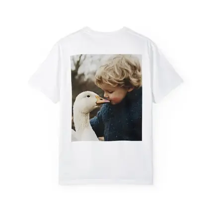 Child Kissing White Goose Outdoors