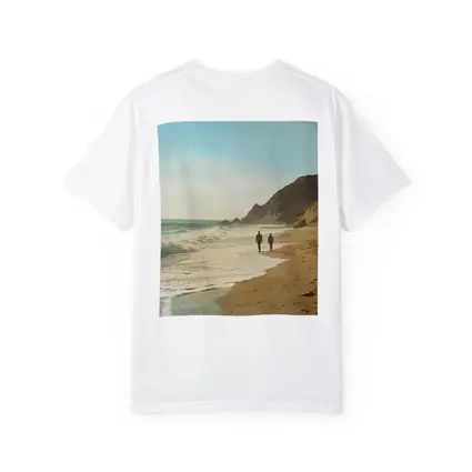 Two People Walking Along Sunny Beach Shore