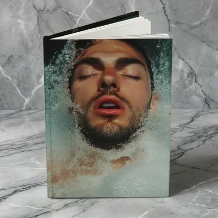 Man Emerging From Water Eyes Closed
