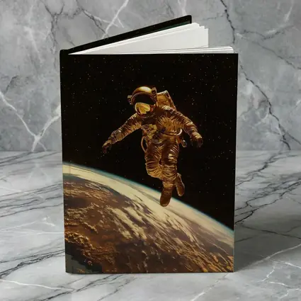 Gold Astronaut Floating Above Earth Stars
