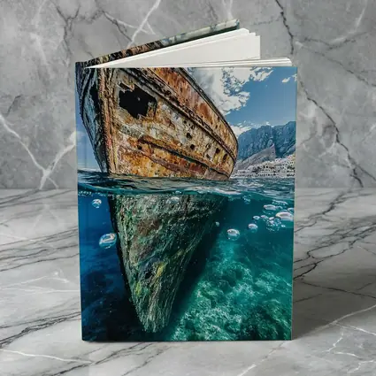 Rusty Shipwreck Split View Clear Ocean Water