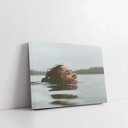 Smiling Woman Swimming In Misty Lake