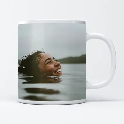 Smiling Woman Swimming In Misty Lake