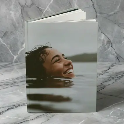 Smiling Woman Swimming In Misty Lake