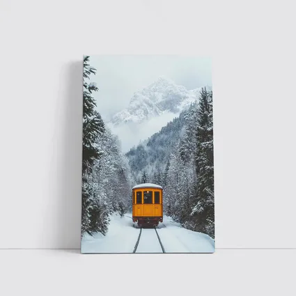 Yellow Train Passing Through Snowy Mountain Forest