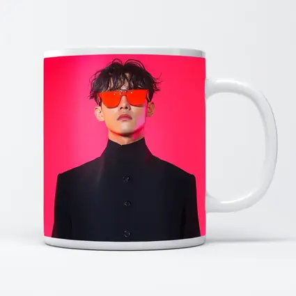 Young Man Red Sunglasses Black Coat Pink Background