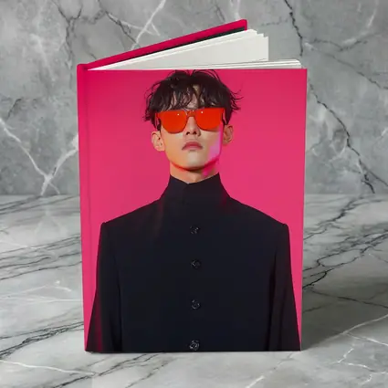 Young Man Red Sunglasses Black Coat Pink Background