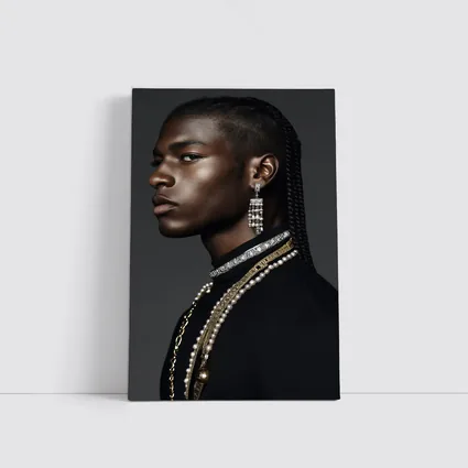 Young Man With Braids and Jewelry Gray Background