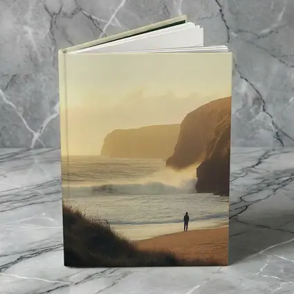 Lone Figure Standing on Golden Coastal Beach