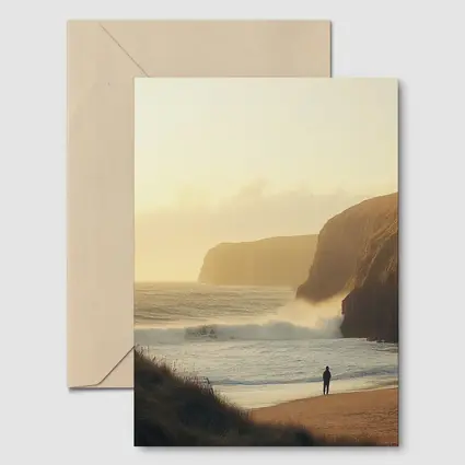 Lone Figure Standing on Golden Coastal Beach