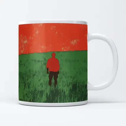 Lone Figure Standing in Green Field
