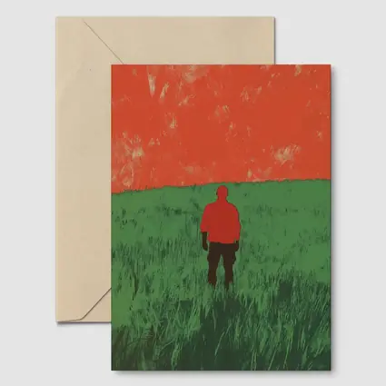 Lone Figure Standing in Green Field