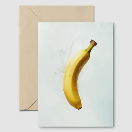 Banana Splashing Through Clear Water Background