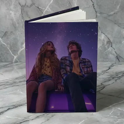 Couple Sitting on Car Under Starry Night