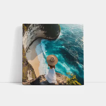 Woman Overlooking Turquoise Cliffside Beach Ocean