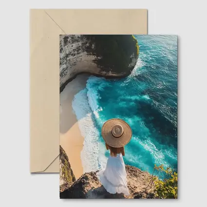Woman Overlooking Turquoise Cliffside Beach Ocean