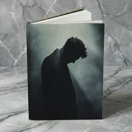 Silhouette Man Head Down Dark Moody Background