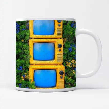 Yellow Retro TVs Stacked Among Wildflowers