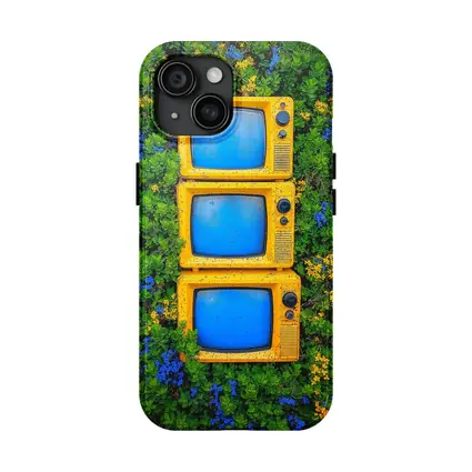 Yellow Retro TVs Stacked Among Wildflowers