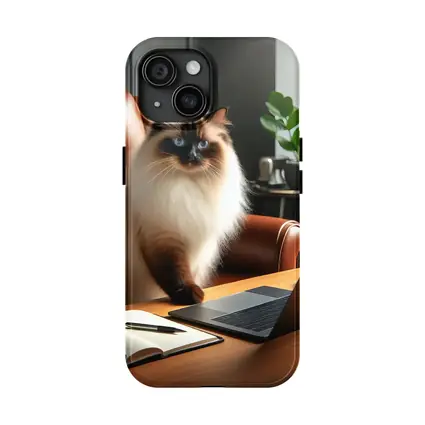 Birman Cat Sitting At Office Desk