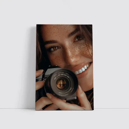 Smiling Woman Holding Camera Close Up
