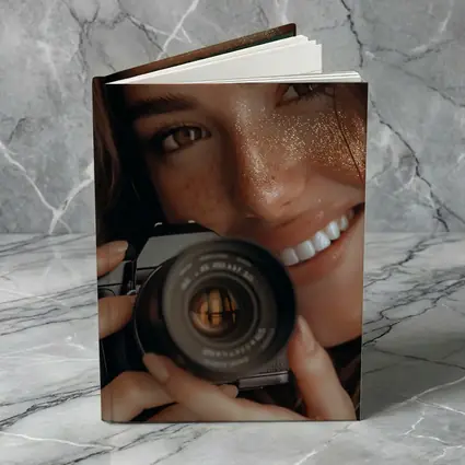 Smiling Woman Holding Camera Close Up