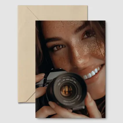 Smiling Woman Holding Camera Close Up