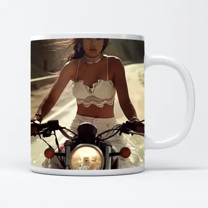 Woman Riding Motorcycle On Open Road