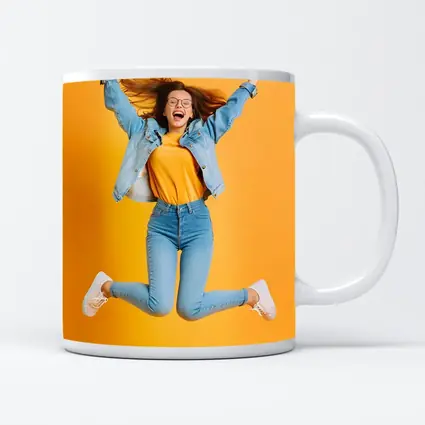 Happy Girl Jumping On Yellow Background