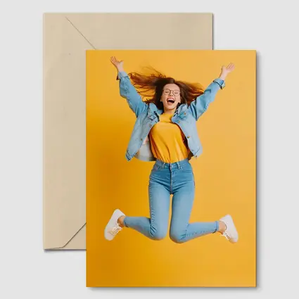 Happy Girl Jumping On Yellow Background