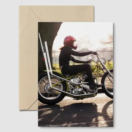 Woman Riding Custom Chopper Motorcycle Street