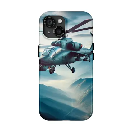 Military Attack Helicopter Flying Over Mountain Landscape