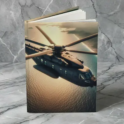 Military Helicopter Flying Over Ocean Sunset