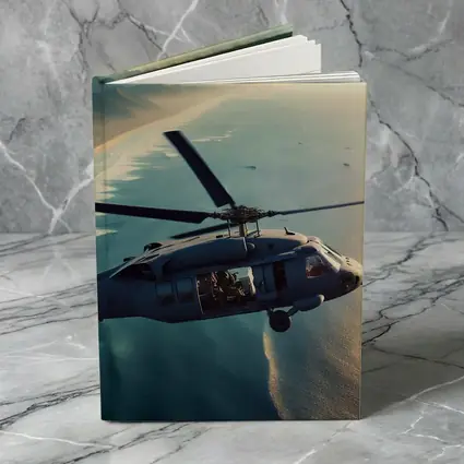 Military Helicopter Flying Over Coastal Shoreline