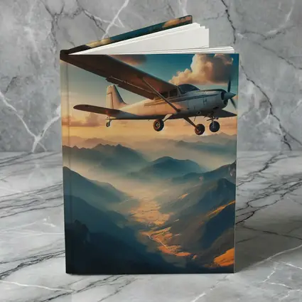 Small Propeller Plane Flying Over Mountains