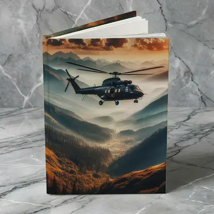 Military Helicopter Flying Over Mountain Valley