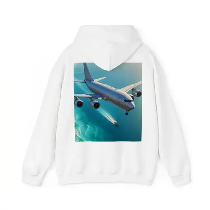 Commercial Airplane Flying Over Turquoise Ocean