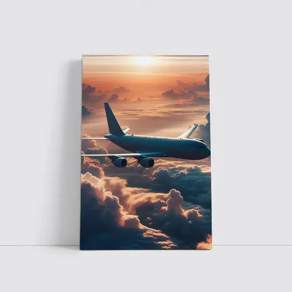 Commercial Airplane Flying Above Sunset Clouds