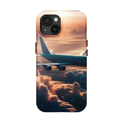 Commercial Airplane Flying Above Sunset Clouds