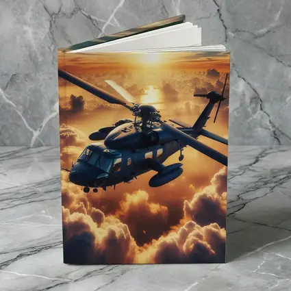 Military Helicopter Flying Above Golden Sunset Clouds