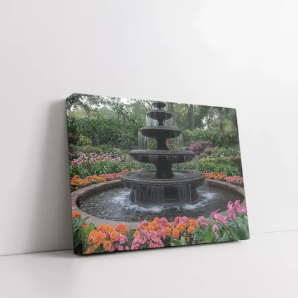 Tiered Garden Fountain Surrounded By Colorful Flowers
