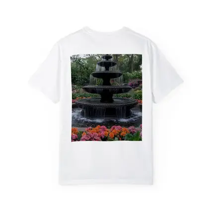 Tiered Garden Fountain Surrounded By Colorful Flowers